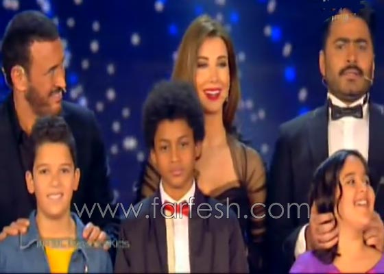بالفيديو: تامر حسني يحرق نتيجة ذا فويس كيدز قبل إعلانها ويهنئ حمزة لبيض صورة رقم 3 بالفيديو: تامر حسني يحرق نتيجة ذا فويس كيدز قبل إعلانها ويهنئ حمزة لبيض صورة رقم 3
